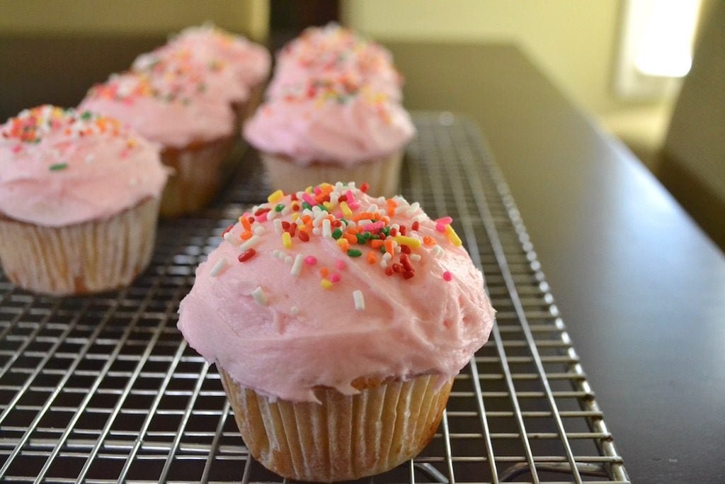 cupcakes with pink frosting and sprinkles