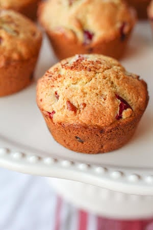 Cranberry Orange Muffins - delcious and bright. Perfect for all your holiday brunches. #twosugarbugs #thiscelbratedlife #cranberryorangemuffins