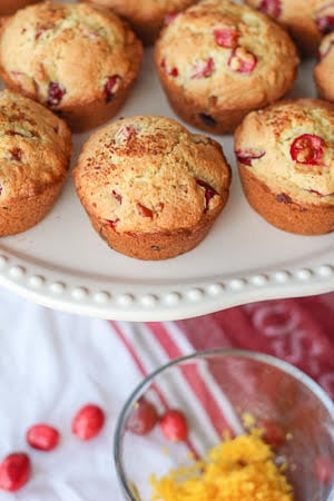 Cranberry Orange Muffins - delcious and bright. Perfect for all your holiday brunches. #twosugarbugs #thiscelbratedlife #cranberryorangemuffins