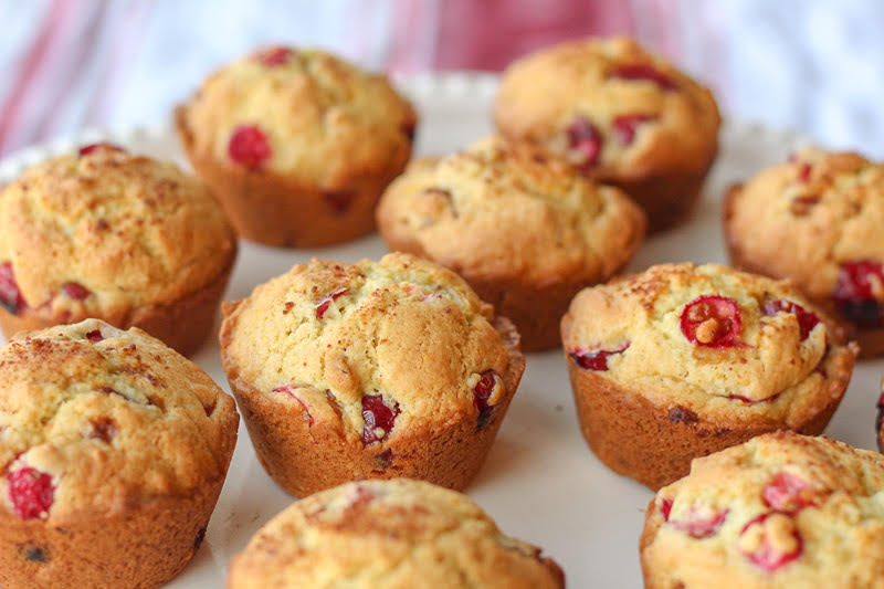 Cranberry Orange Muffins - delcious and bright. Perfect for all your holiday brunches. #twosugarbugs #thiscelbratedlife #cranberryorangemuffins