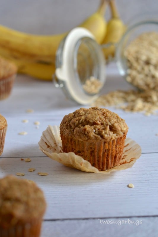 Banana Oat Bran muffins, made healthier with zero refined sugar and packed with oats and bran to keep you full and running through your morning.  #twosugarbugs #healthymuffins #banana.  