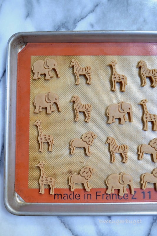 unbaked animal crackers on a silicone baking mat