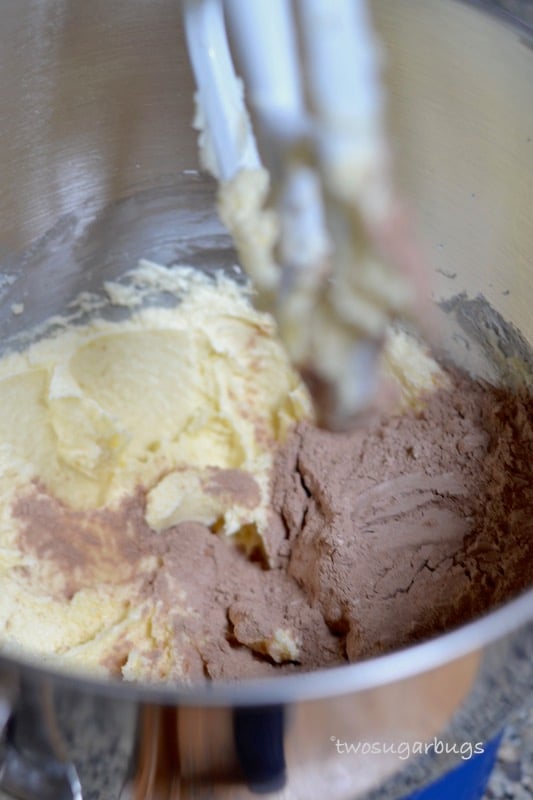 butter and cocoa powder in mixer bowl