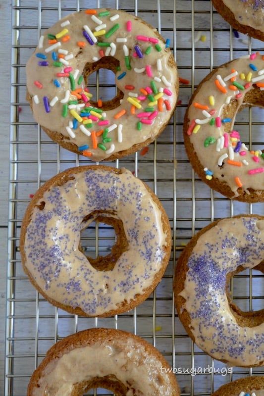 Several donuts on a wire rack