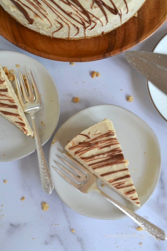Two pieces of peanut butter pie on plates with forks