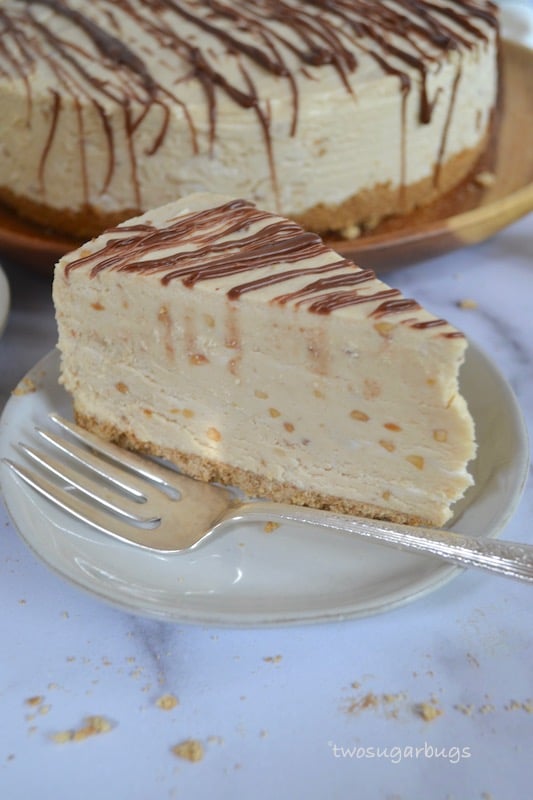 Slice of peanut butter pie on a plate with a fork