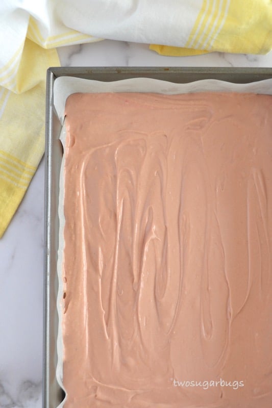 Pink velvet cake batter in baking pan