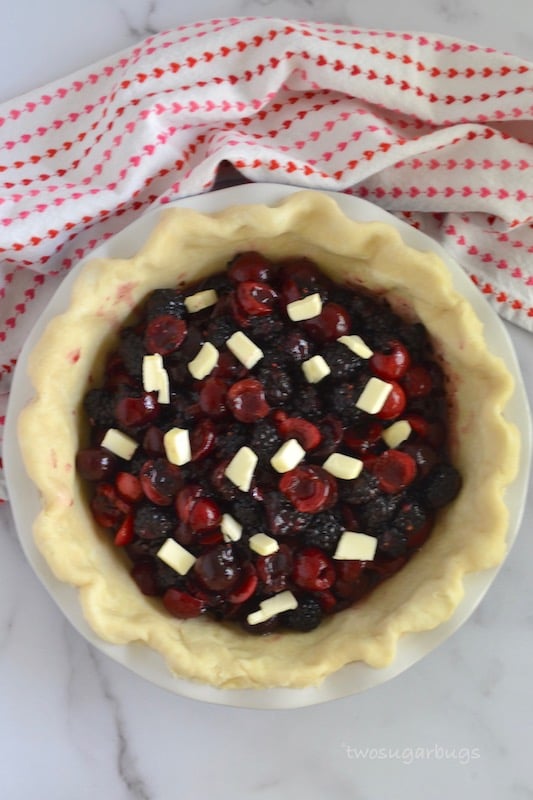 Blackberry cherry pie filling dotted with butter