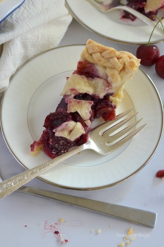 Slice of pie on a plate with a fork