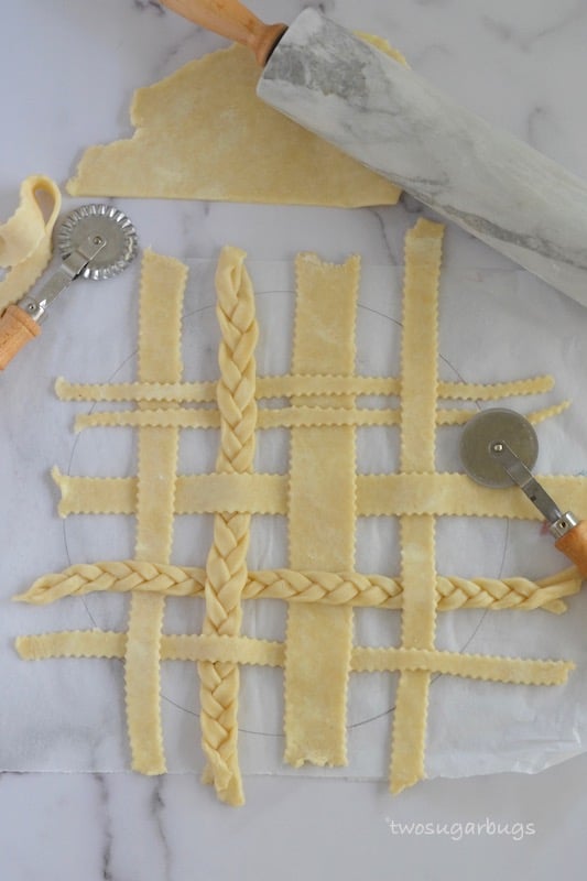 Lattice pie topping laid out on parchment paper