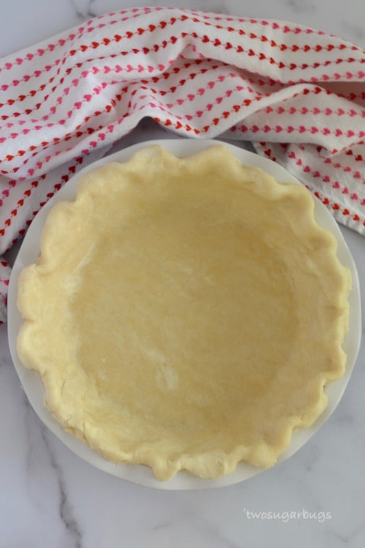 Pie dough fitted into a pie plate