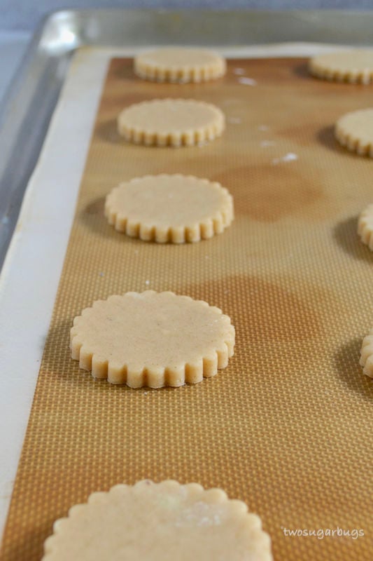 Cinnamon cut-out cookie dough on silicone baking mat