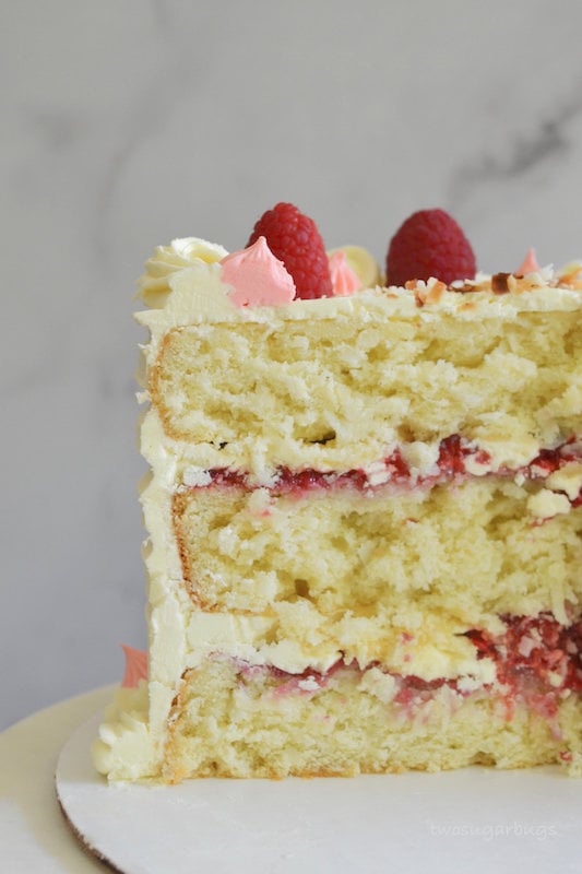 Inside shot of perfect coconut cake with raspberries