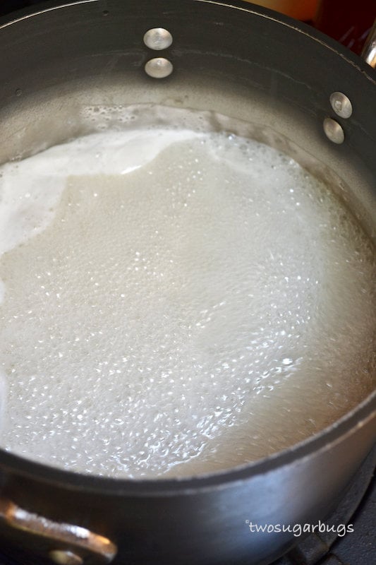 Sugar, water and gelatin mixture at a low boil in saucepan.