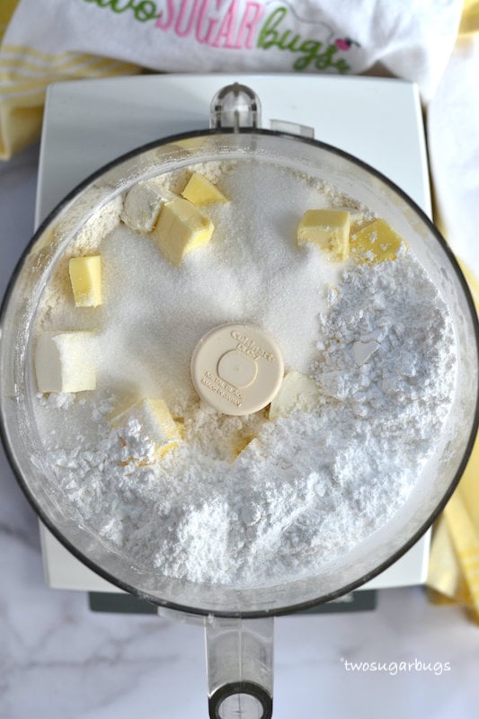 flour, butter, sugars and cream cheese in a food processor
