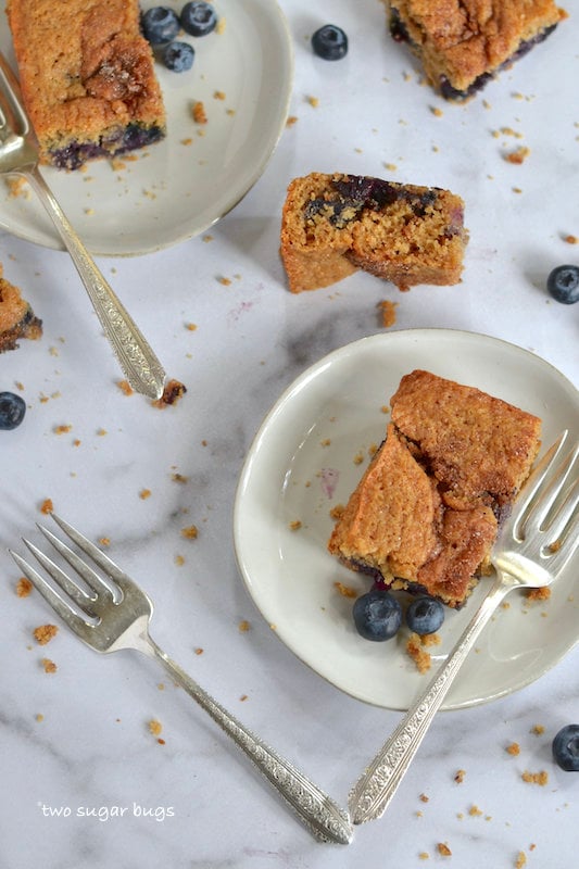 blueberry coffee cake on plates with forks