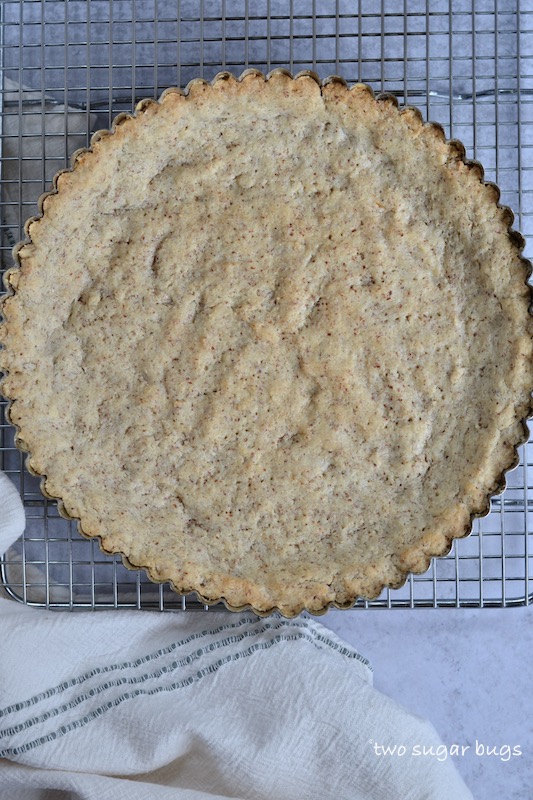 baked tart crust on a cooling rack