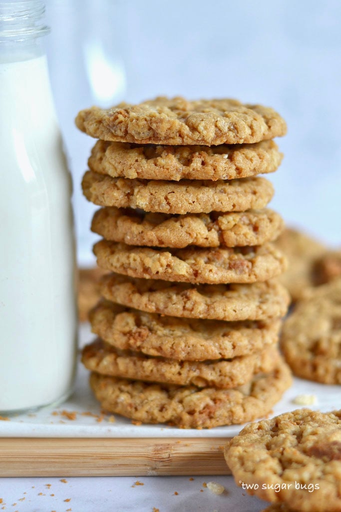 Stack of biscoff crispy cookies with a bottle of milk