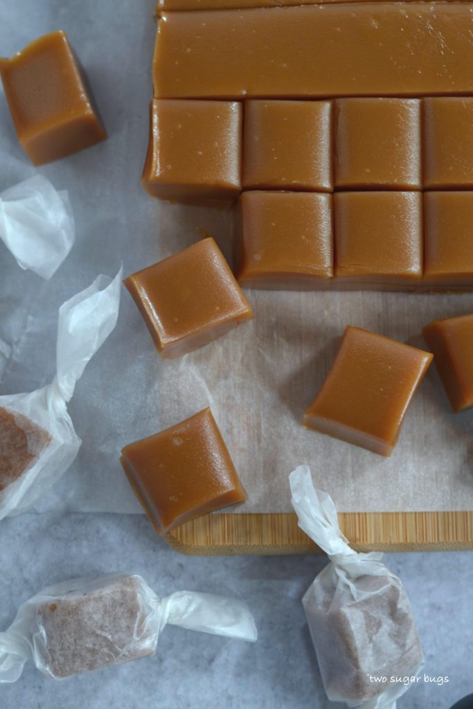 caramel treats with minimal ingredients on a parchment lined cutting board