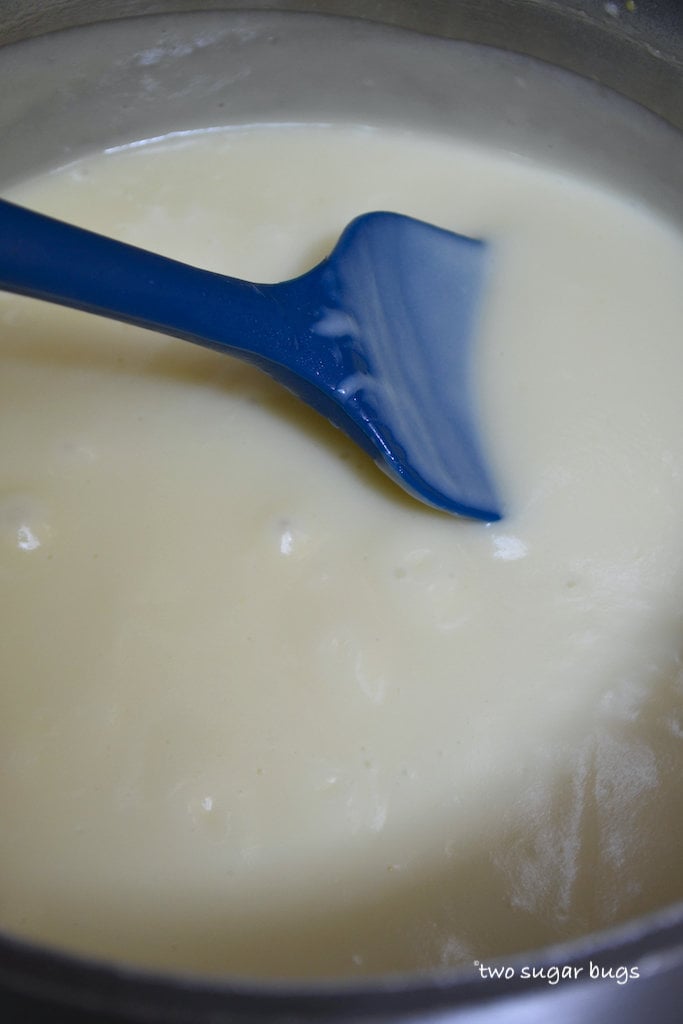 coconut cream at a low boil in a saucepan