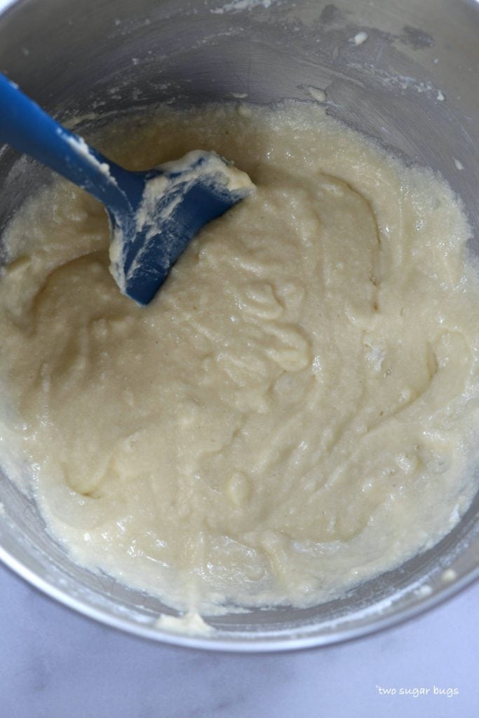 finished cake batter in mixing bowl with a spatula