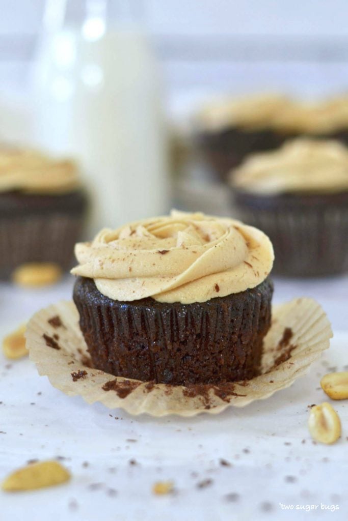 up close photo of chocolate peanut butter cupcake with the liner off