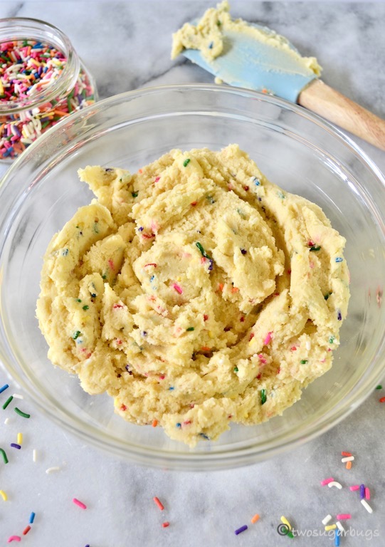 sugar cookie bar dough in a glass bowl