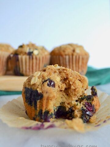Hearty whole wheat blueberry oat muffins. Perfect for breakfast! #twosugarbugs #blueberryoatmuffin #muffin #breakfastisserved