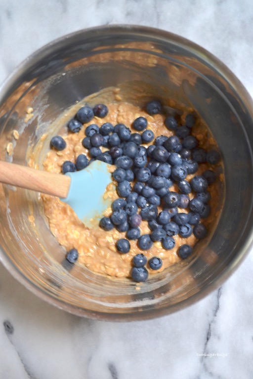 Hearty whole wheat blueberry oat muffins. Perfect for breakfast! #twosugarbugs #blueberryoatmuffin #muffin #breakfastisserved