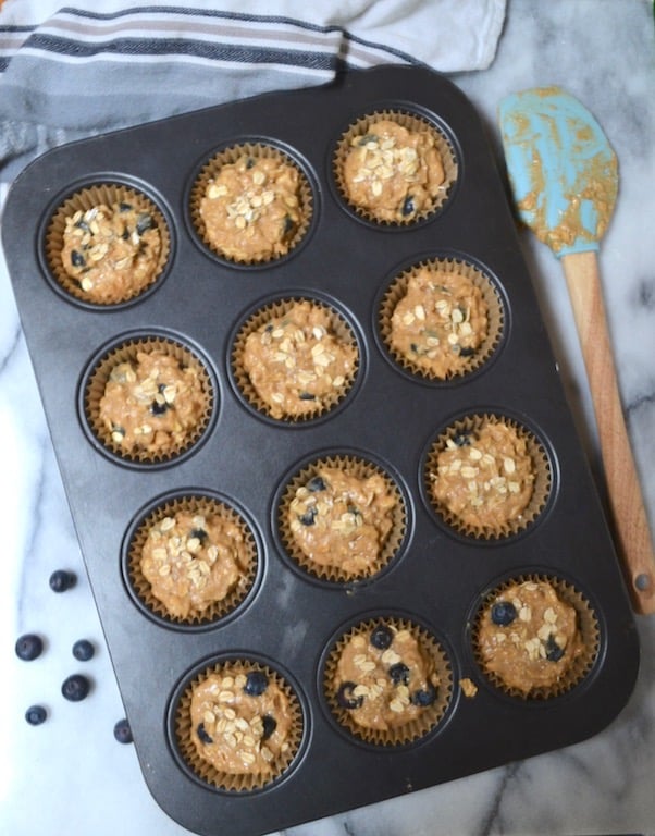 Hearty whole wheat blueberry oat muffins. Perfect for breakfast! #twosugarbugs #blueberryoatmuffin #muffin #breakfastisserved