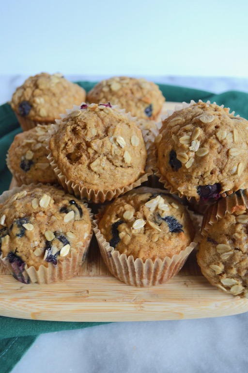 Hearty whole wheat blueberry oat muffins. Perfect for breakfast! #twosugarbugs #blueberryoatmuffin #muffin #breakfastisserved