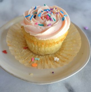 Simply Vanilla Cupcakes and Favorite American Buttercream. Perfect for piping sugar cookies, cakes and cupcakes. #twosugarbugs #americanbuttercream #buttercreamfrosting #vanillacupcakes
