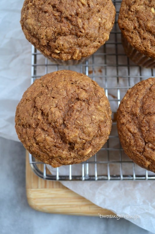 A healthier gingerbread muffin with a cream cheese cinnamon drizzle, packed with oats and bran to help keep you full and running through your busy morning. #twosugarbugs #gingerbread #healtiermuffins #breakfastisserved