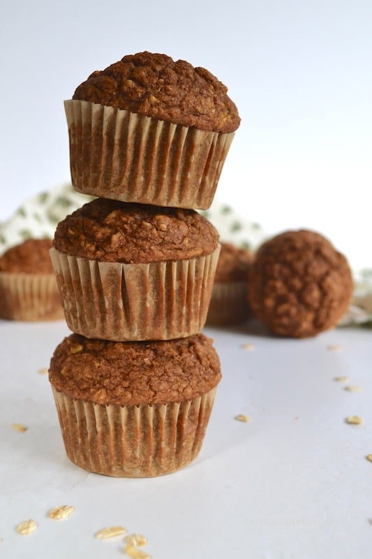 A healthier gingerbread muffin with a cream cheese cinnamon drizzle, packed with oats and bran to help keep you full and running through your busy morning. #twosugarbugs #gingerbread #healtiermuffins #breakfastisserved