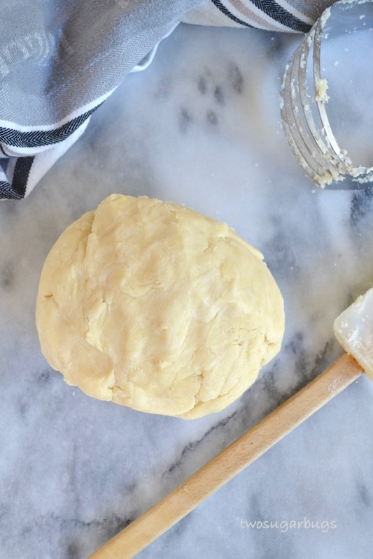 Easy and perfect all butter pie crust. You'll want this for all your holiday pies. #twosugarbugs #allbutterpiecrust #homemadepiecrust #fallbaking