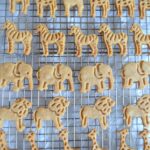 Homemade Graham Animal Crackers. Kid friendly and mom approved! Perfect on their own or add a twist with glaze and sprinkles. #twosugarbugs #homemadegrahamcrackers #animalcrackers #cutefood #lunchboxtreats