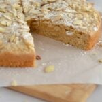 Crumbly almond cake with a slice missing