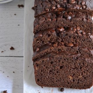 Overhead shot of chocolate zucchini bread on parchment paper
