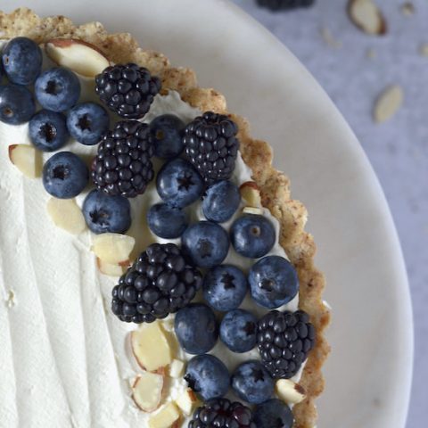 close up of almond and berry mascarpone tart