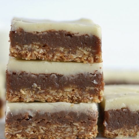 close up of double chocolate oat bottom brownies stacked up