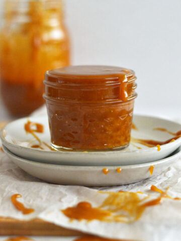 cookie butter caramel in a jar on a plate