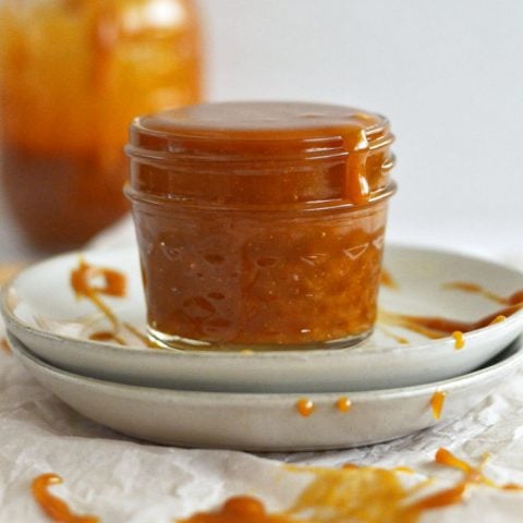 cookie butter caramel in a jar on a plate