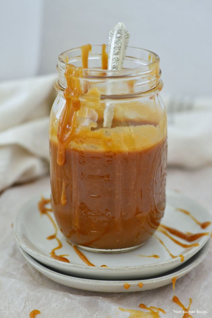 cookie butter caramel in a jar with a spoon