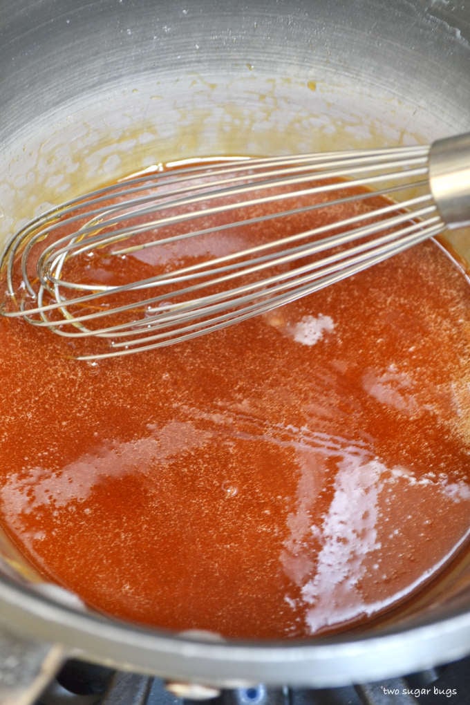 melted sugar in a sauce pan with a whisk