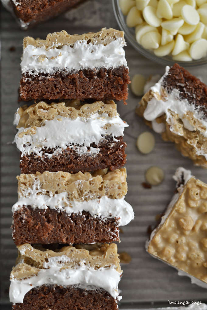 stack of SunButter crunch brownies with a bowl of white chocolate chips