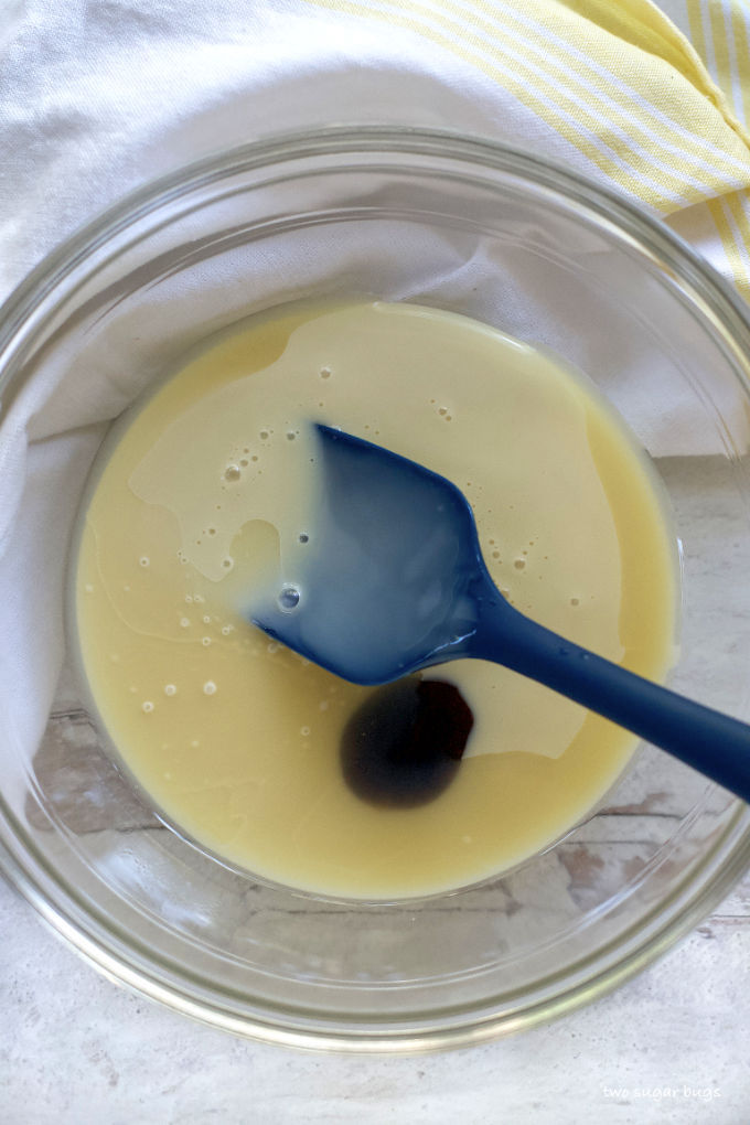 lemon juice, vanilla bean paste and sweetened condensed milk in a bowl