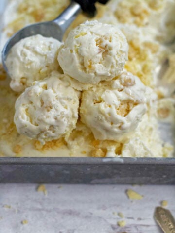 scoops of lemon white chocolate cookie ice cream in a baking pan