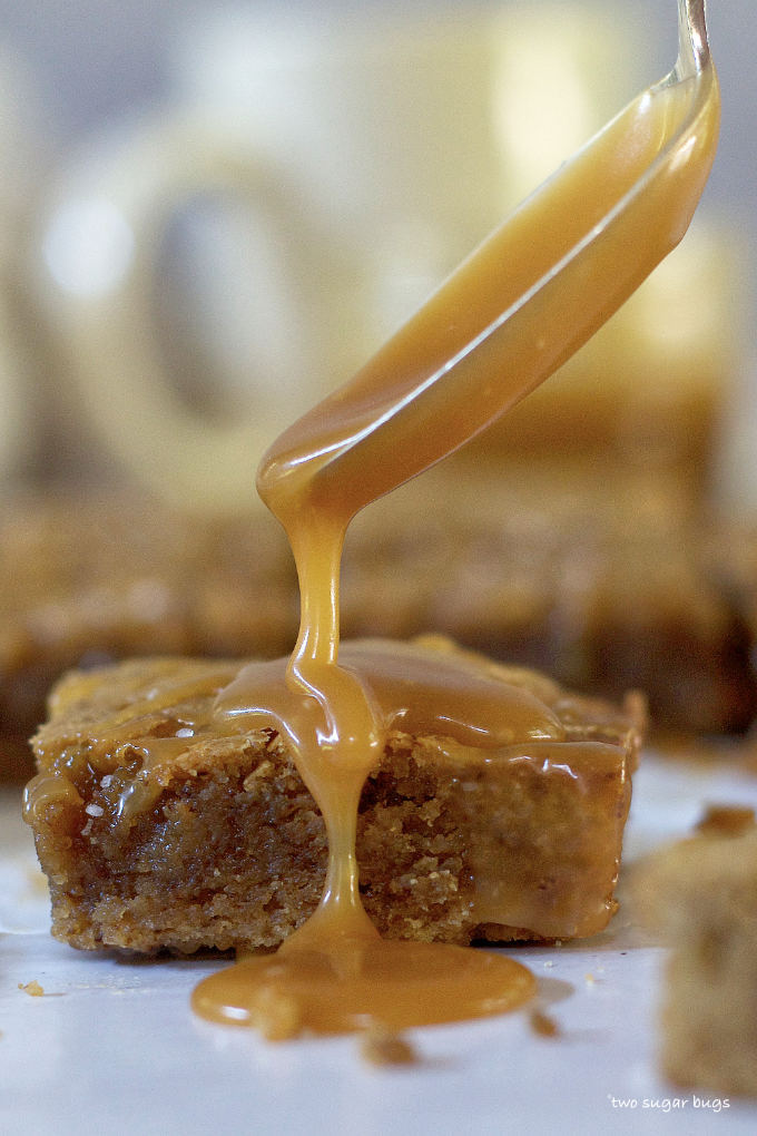 spoon drizzling salted caramel over an espresso bar