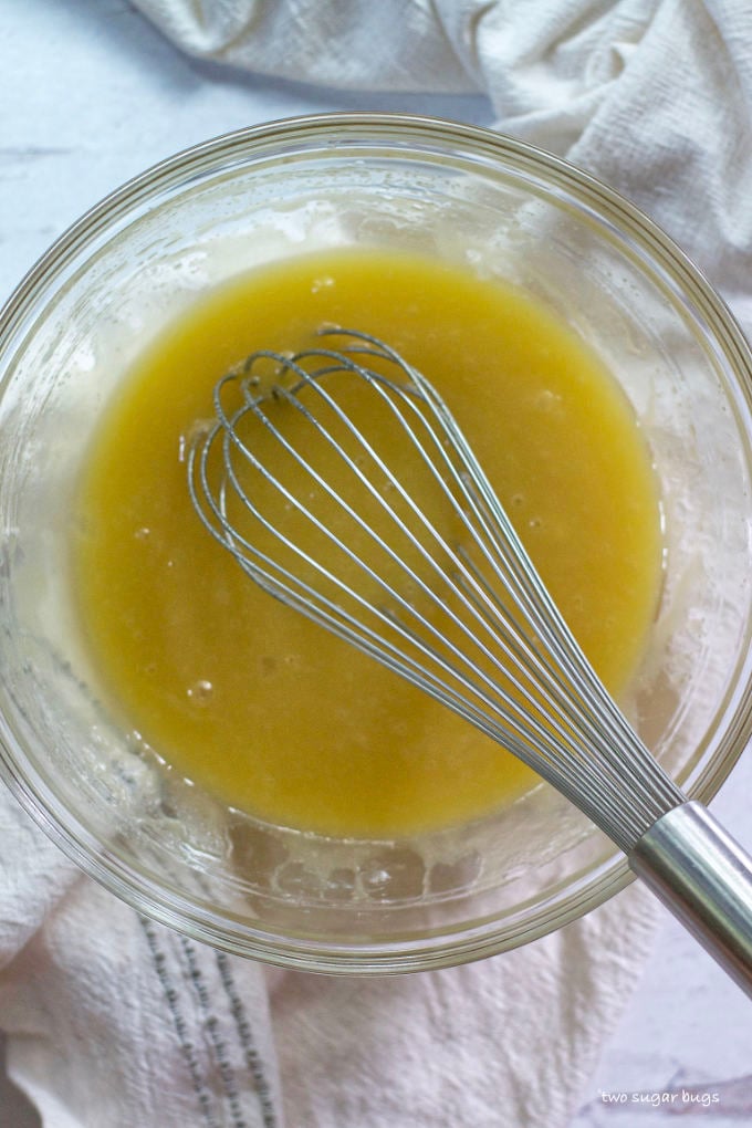 butter, white chocolate, sugar, eggs and vanilla whisked in a bowl