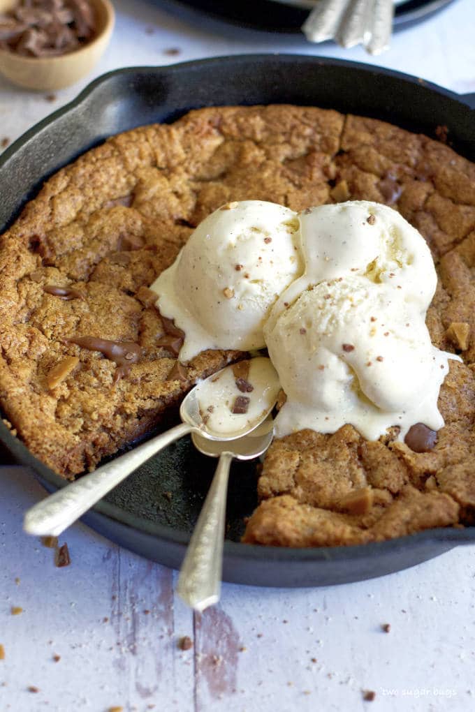 skillet cookie with ice cream and two spoons